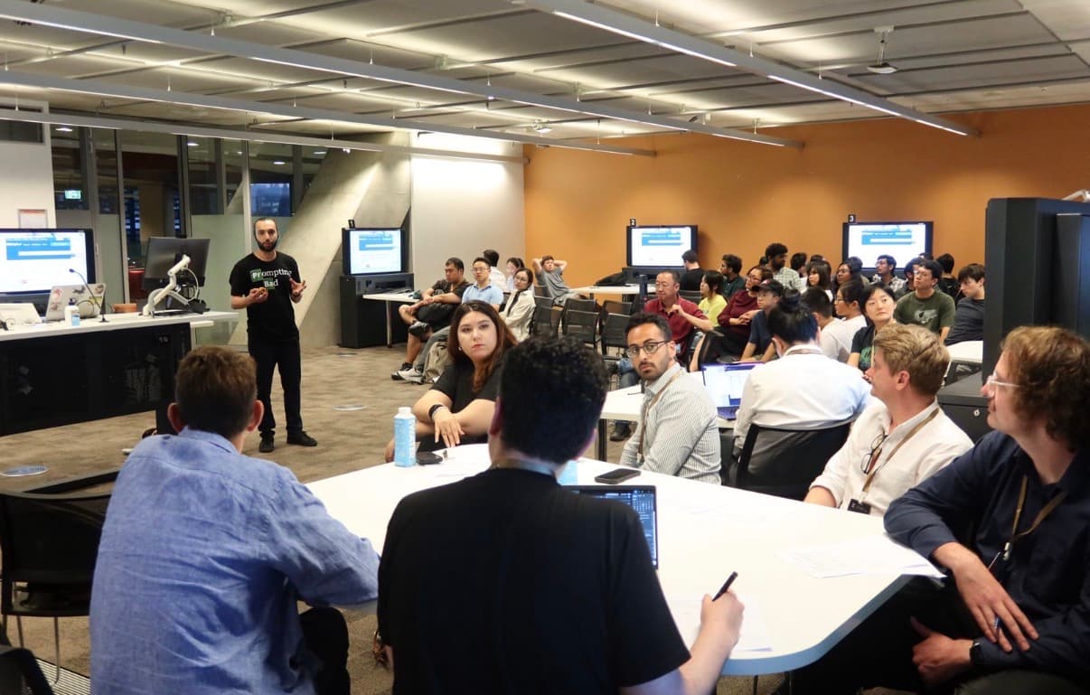 Armin Alimardani presenting the Friction prototype to a seated audience at the EduX Oceania Hackathon.
